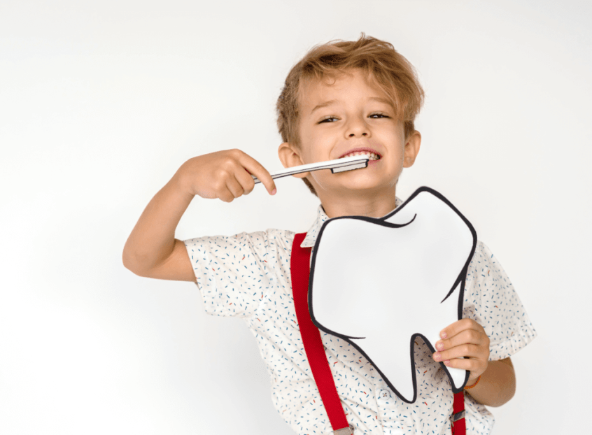 young patient brushing his teeth after getting dental bonding